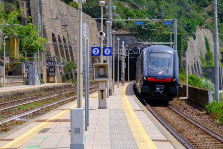Corniglia, IT - 25 July 2024: Train entering Corniglia stationのeditorial素材