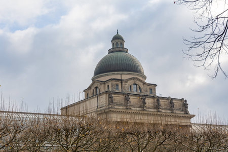 dome roof of historic war memorial in the courtyard munich city bavaria germany cloudy overcast winter day sun rays coming thtoughの写真素材