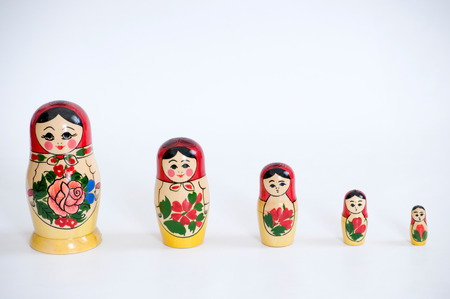 Set of russian dolls of decreasing sizes  Usually are placed one inside another   Isolated on whiteの写真素材