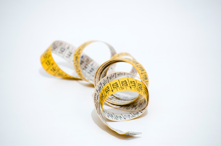 whirled yellow tape measureの写真素材