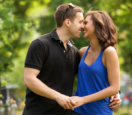Young couple in love outdoorin lovekissing and embracingの写真素材