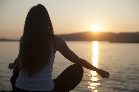 Relaxation on the water outdoors, woman with hands upの写真素材