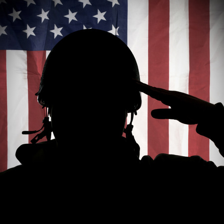 American USA soldier saluting to USA flagの写真素材