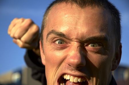 face and fist of a very angry man.face and fist of a very angry man.の写真素材