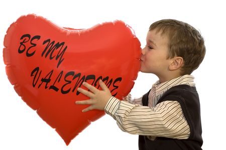 little 5-year old holding a valentine heart.の写真素材