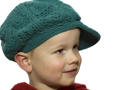 Cute picture of a little 3 year old wearing a green hat.の写真素材