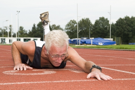 Active senior finally made it to the finish line.の写真素材