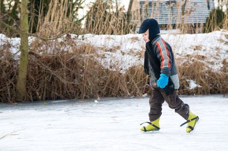 Boy ice skating for the first timeの写真素材