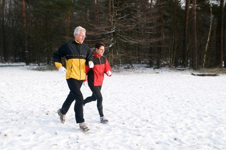 Running seniors in wintertimeの写真素材