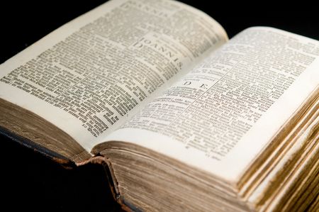 Nice old bible with an old lock on a black background.の写真素材