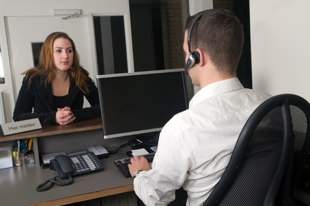 Customer getting some information at a service desk