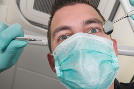 Picture of the dentist, as seen from the patient's point of view, lying in the chairの写真素材