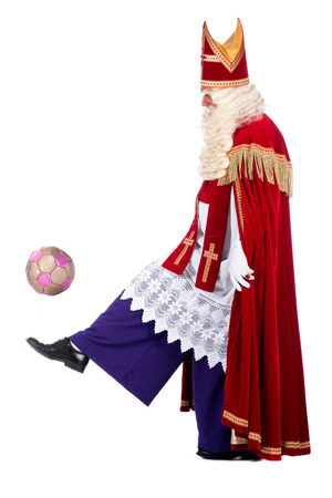 Santa Claus playing soccer, on a white の写真素材