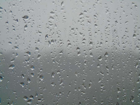 Window glass wet by rainwater. Window glass wet by rainwater.の写真素材