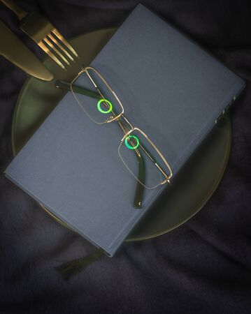 Dinner and literature metaphor with live glassesの写真素材