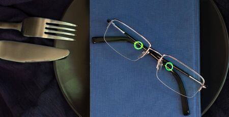 Dinner and literature metaphor with live glassesの写真素材