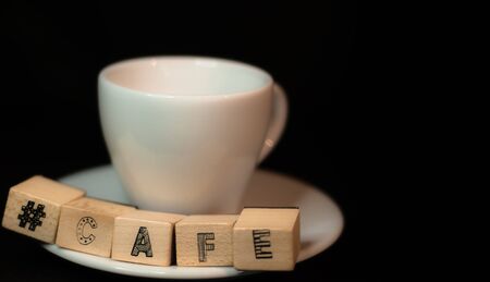 Colombian coffee cup on beans and dark backgroundの写真素材