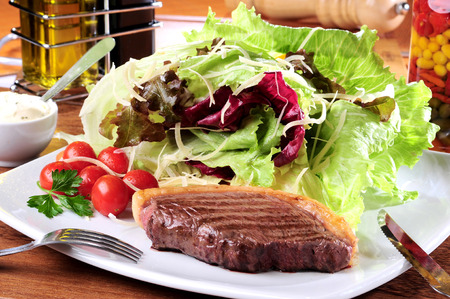 Grilled meat and saladの写真素材