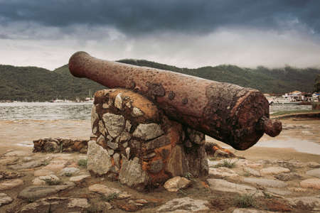 Old cannon in the city of Paraty, state of Rio de Janeiro, Brazil.の写真素材