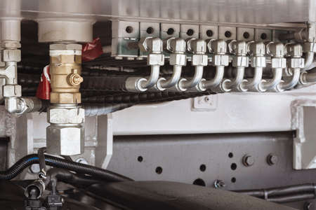Detail of a hydraulic control mechanism of a concrete pump truck.