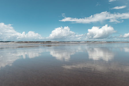 View of a tropical beach with clouds on the horizon in Porto de Galinhas, Brazil.