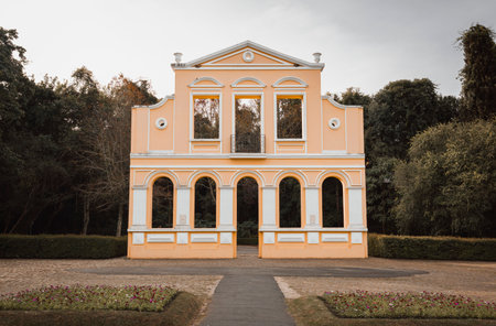 Replica of a German house with a neoclassical facade, with symmetrical columns and arches located in...