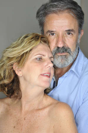 Mature couple together embracing smilingの写真素材