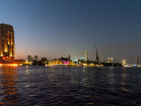 Night view of the city of Cairo from a boat on the Nile River, Egyptの写真素材