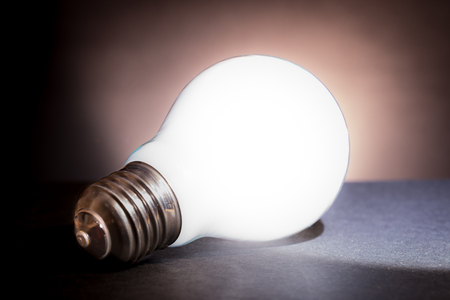 a lamp glowing on a black tableの写真素材