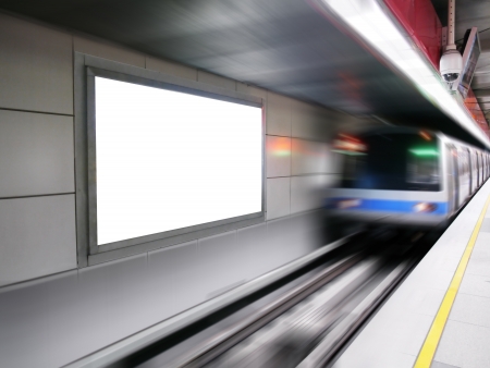 Blank billboard in subway station