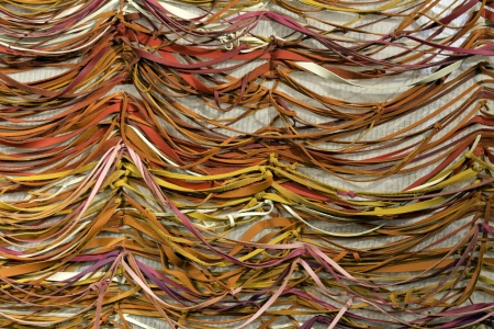 Leather pieces on white mesh backgroundの写真素材