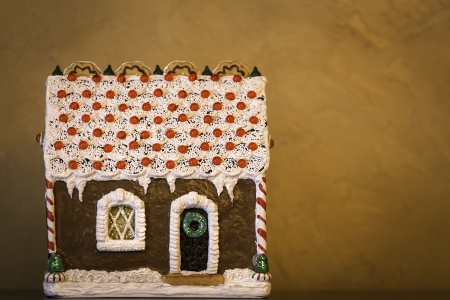 Gingerbread house on brown backgroundの写真素材