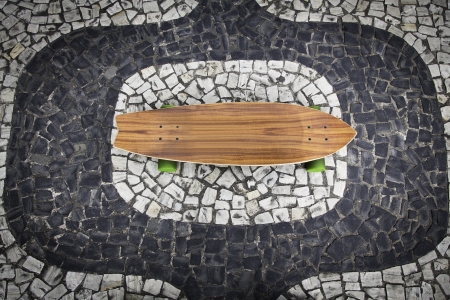 Skateboard on Ipanema mosaic as background in Rio de Janeiroの写真素材