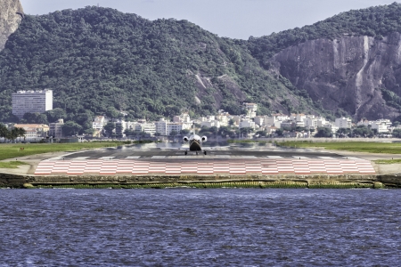 Jet ready to take off against Sugar Loaf mountain in Rio de Janeiroの写真素材