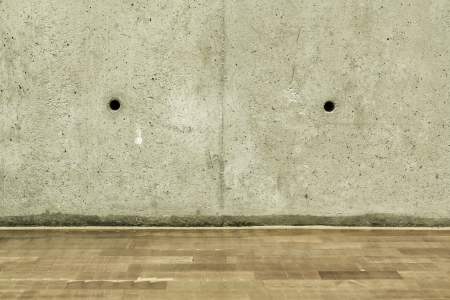 Concrete crack wall and brown hardwood floorの写真素材