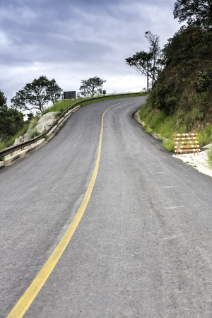 Empty curved asphalt roadの写真素材