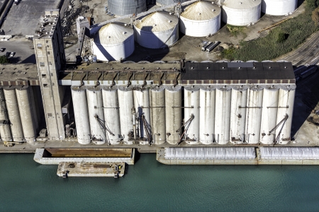 Storage silos aerial view in industrial zone by the riverのeditorial素材
