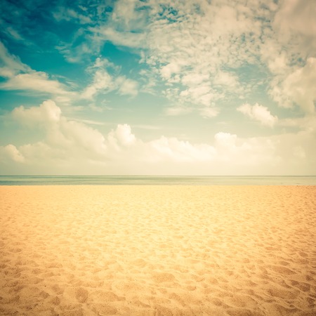 Sunshine on empty beach - vintage lookの写真素材
