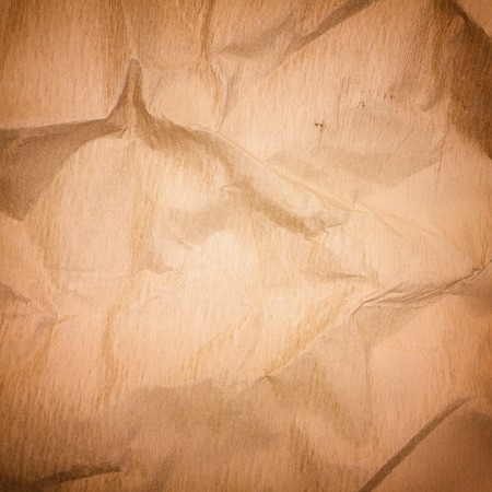 Crumpled vintage paper backgroundの写真素材