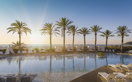 Beautiful sunrise at a beach resort in tropicsのeditorial素材