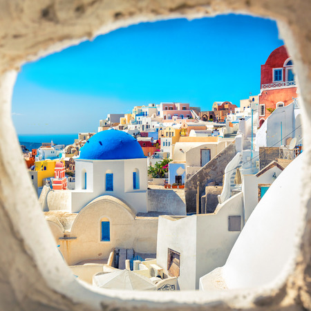 Santorini blue dome church look through the chimney, Greeceの写真素材