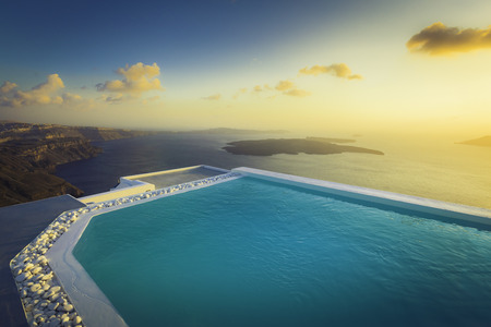 Infinity pool on the rooftop at sunset in Santorini Island, Greeceのeditorial素材