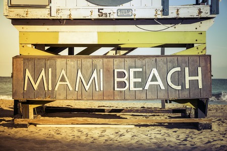 Miami Beach sign on wood background, South Beach, Floridaの写真素材