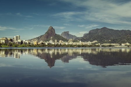 Sunrise over mountains in Rio de Janeiro with water reflection, Brazilの写真素材