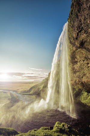 Seljalandsfoss Waterfall in South Iceland with sunlightの写真素材