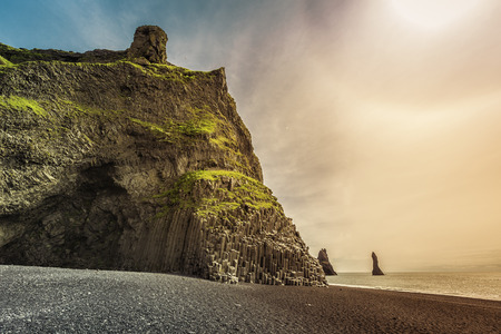 The black sand beach of Reynisfjara near Vik with light leak, Icelandの写真素材
