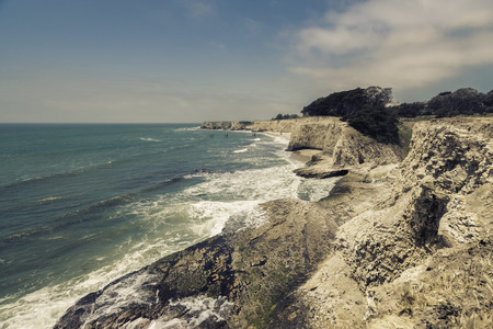 Empty Beach with steep cliffs - vintage view