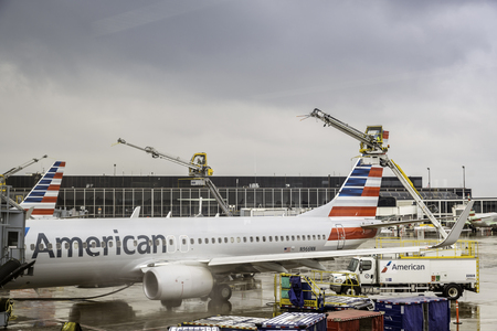 CHICAGO,UNITED STATES - JANUARY 22: Deicing of the American Airlines planes before take off on January 22, 2016 in Chicago. Deicing on O'Hare International Airport due to cold and snowy conditions.のeditorial素材