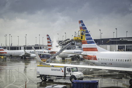 CHICAGO,UNITED STATES - JANUARY 22: Deicing of the American Airlines planes before take off on January 22, 2016 in Chicago. Deicing on O'Hare International Airport due to cold and snowy conditions.のeditorial素材