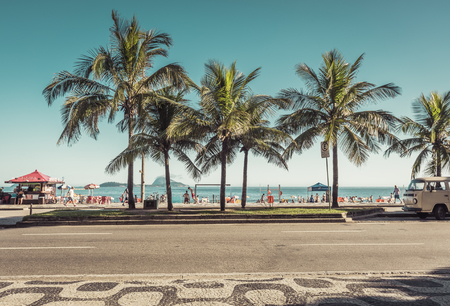 RIO DE JANEIRO, BRAZIL - FEBRUARY  2016: People enjoying the sun on iconic Ipanema Beach in Rio de Janeiro. Rio will host 2016 Summer sports competition Games.のeditorial素材